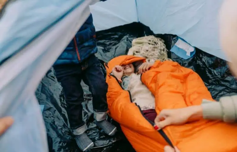 A woman inside a sleeping bag