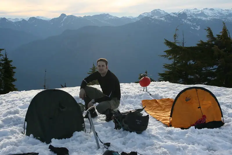 A man with a bivvy bag in the high point on Panorama Ridge